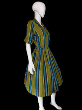 Load image into Gallery viewer, A short-sleeve collared dress with vertical blue, teal, and olive green stripes, displayed on a white mannequin.