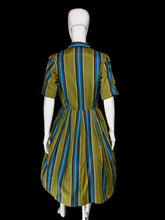 Load image into Gallery viewer, A short-sleeve collared dress with vertical blue, teal, and olive green stripes, displayed on a white mannequin.