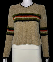 Load image into Gallery viewer, A close up of a cropped knit sweater displayed on a white mannequin, featuring a beige body with horizontal stripes in green, orange, and black across the chest and on the sleeves.