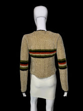 Load image into Gallery viewer, A beige textured knit sweater with horizontal stripes in green, red, and black on the back, displayed on a white mannequin.