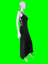 Load image into Gallery viewer, A black sleeveless maxi dress with sheer straps and a sheer back covered in a spiderweb print shown on a white mannequin from the side.