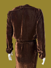 Load image into Gallery viewer, A dark brown velvet 1920s set featuring a midi length dress and matching long sleeve cropped jacket displayed on a white mannequin.