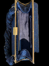 Load image into Gallery viewer, A top-down view of a rectangular evening clutch bag with a blue beaded exterior, gold-tone metal frame, and a matching beaded strap.