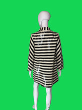 Load image into Gallery viewer, A black and cream striped long-sleeve shirt dress displayed on a white mannequin, viewed from the back.