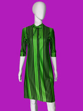 Load image into Gallery viewer, A green and black vertically striped dress displayed on a white mannequin against a plain white wall.