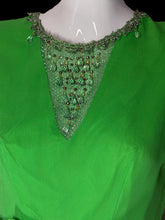 Load image into Gallery viewer, A bright green traditional-style top displayed on a white mannequin torso, featuring a V-neckline with ornate green beaded mesh and dangling green teardrop embellishments.