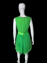 Load image into Gallery viewer, A bright green sleeveless dress displayed on a white mannequin shown from the back.