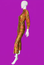Load image into Gallery viewer, A mannequin wearing a long-sleeve, high-neck two-piece set with a bold retro geometric pattern in orange, yellow, and red.