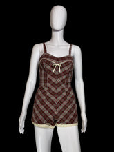 Load image into Gallery viewer, A brown, red, green, and beige plaid bathingsuit displayed on a white mannequin.