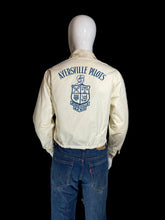 Load image into Gallery viewer, An off-white bomber jacket with blue 'Aversville Pilots' text and crest printed on the back, displayed on a mannequin.