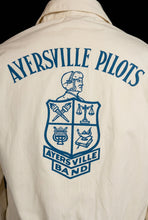 Load image into Gallery viewer, A close-up of locked blue crest and text graphic on the back reading "Ayersville Pilots"