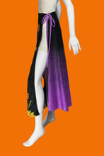 Load image into Gallery viewer, A mannequin wearing a black and purple gradient skirt with yellow floral details with a high slit.