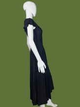 Load image into Gallery viewer, Black dress on a mannequin against a plain background