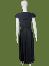 Load image into Gallery viewer, Black dress on a mannequin against a plain background