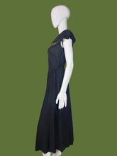 Load image into Gallery viewer, Black dress on a mannequin against a plain background