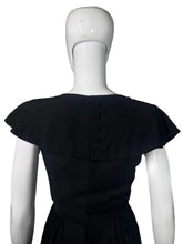 Load image into Gallery viewer, Black dress on a mannequin against a plain background