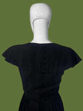 Load image into Gallery viewer, Black dress on a mannequin against a plain background