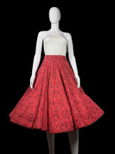 Load image into Gallery viewer, Mannequin wearing a red patterned skirt.