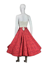 Load image into Gallery viewer, Mannequin wearing a red patterned skirt.