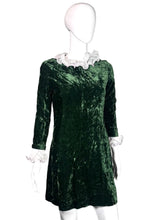 Load image into Gallery viewer, Green velvet dress on a mannequin.