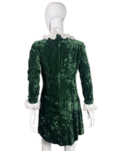 Load image into Gallery viewer, Green velvet dress on a mannequin.