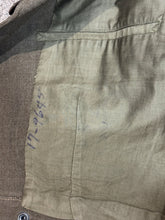 Load image into Gallery viewer, Close-up of a interior with visible stitching details and writing.