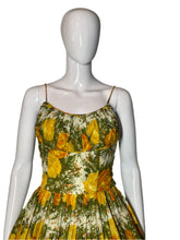 Load image into Gallery viewer, Mannequin wearing a floral dress with yellow flowers on a white background