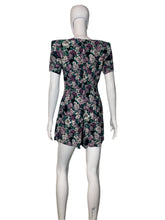 Load image into Gallery viewer, Floral-patterned romper on a mannequin against a white background