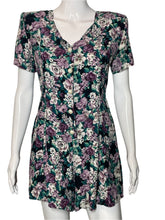Load image into Gallery viewer, Floral-patterned romper on a mannequin against a white background