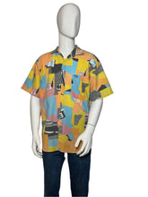 Load image into Gallery viewer, Mannequin wearing a colorful patterned shirt on a plain background
