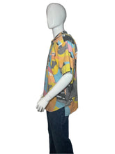 Load image into Gallery viewer, Mannequin wearing a colorful patterned garment on a plain background