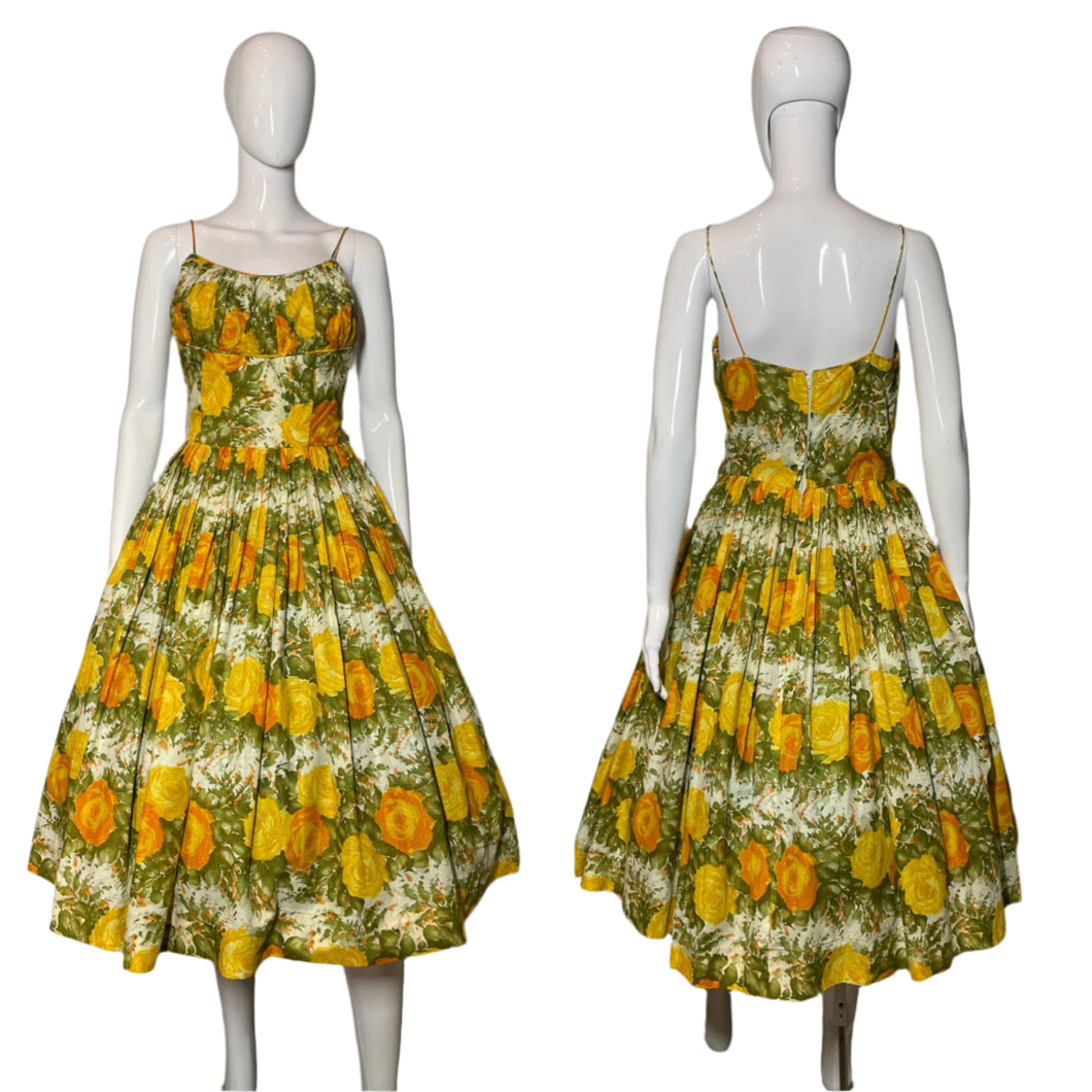 Yellow floral dress on a mannequin against a plain background
