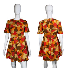 Load image into Gallery viewer, A mannequin wearing a colorful patterned dress against a white background
