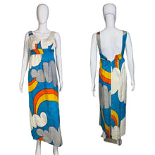 Load image into Gallery viewer, Colorful dress with cloud and rainbow design on mannequins against a plain wall.
