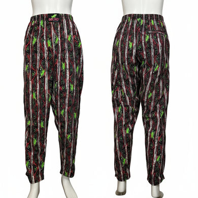 Pair of patterned pants on mannequins against a white background