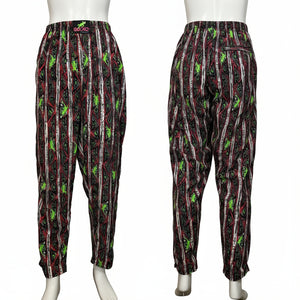 Pair of patterned pants on mannequins against a white background
