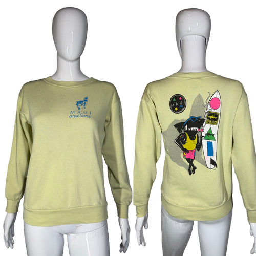 Light yellow sweatshirt with 'Maui and Sons' logo on front and colorful graphic on back, displayed on mannequins.
