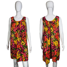 Load image into Gallery viewer, Colorful floral dress on a mannequin against a neutral background

