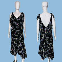 Load image into Gallery viewer, A black floral midi dress displayed on a white mannequin, shown from both the front and back views side-by-side.
