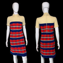 Load image into Gallery viewer, A short-sleeve mock-neck dress displayed on a white mannequin, showing both front and back views. The dress features a solid pale yellow top section and a red, navy blue, and cream plaid patterned lower section.
