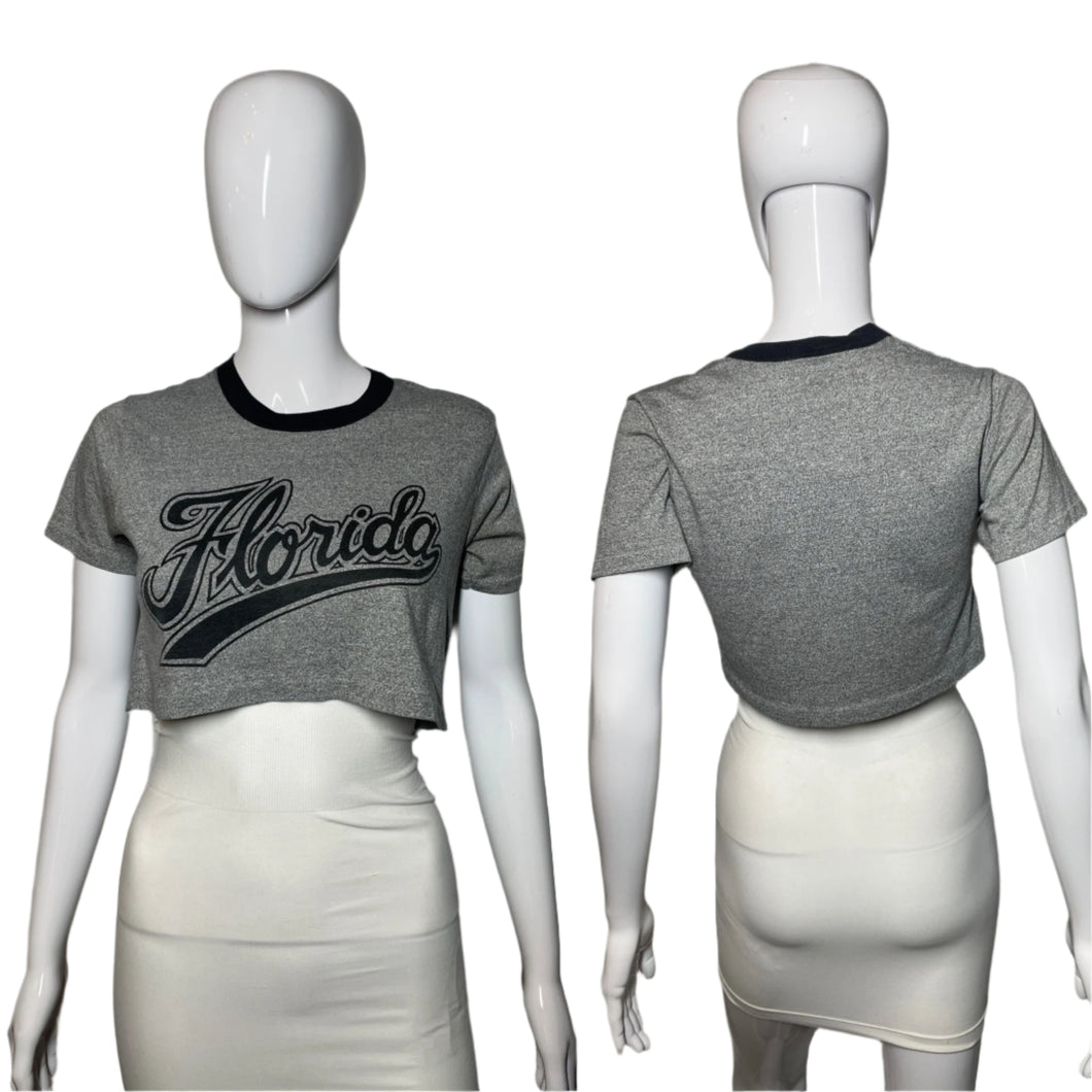 Gray t-shirt with 'Florida' print on a mannequin against a plain background