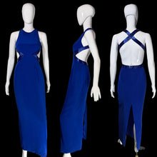 Load image into Gallery viewer, A royal blue sleeveless maxi dress displayed on a white mannequin from three angles: front, side, and back. The dress features cutouts at the waist and hips with a shimmering textured trim, and a high slit on the back.
