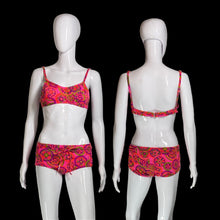 Load image into Gallery viewer, A two-piece bikini set with a bright pink, orange, and green paisley pattern, displayed on two white mannequins showing both front and back views.
