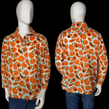 Load image into Gallery viewer, A long-sleeve button-up shirt with an all-over orange jack-o'-lantern print, shown on a white mannequin from both the front and back views against a plain gray wall.
