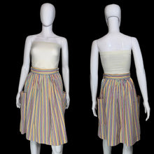 Load image into Gallery viewer, A vintage striped skirt shown on a white mannequin from both front and back views. The skirt features vertical stripes in yellow, blue, orange, and red on a white base, with side pockets.
