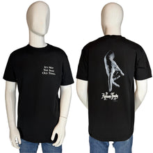 Load image into Gallery viewer, Black t-shirt with text and graphic design on a mannequin, shown from front and back.
