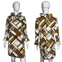 Load image into Gallery viewer, Patterned dress on a mannequin against a plain background
