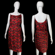Load image into Gallery viewer, A sleeveless red and black floral dress displayed on a white mannequin from both the front and back views.
