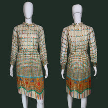Load image into Gallery viewer, A long-sleeve midi dress with a pleated texture, featuring a beige base with colorful horizontal stripes and a vibrant geometric pattern near the hem, displayed on a white mannequin shown from the front and back.
