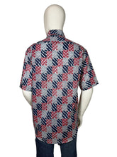 Load image into Gallery viewer, Mannequin wearing a patterned shirt on a plain background
